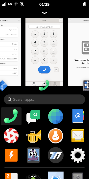 Thumbnails of running apps appear above the icons in the app drawer